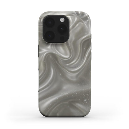 Trendy phone case featuring a dreamy, flowing silver and beige swirl pattern with a subtle pearlescent effect, perfect for a chic and feminine look.
