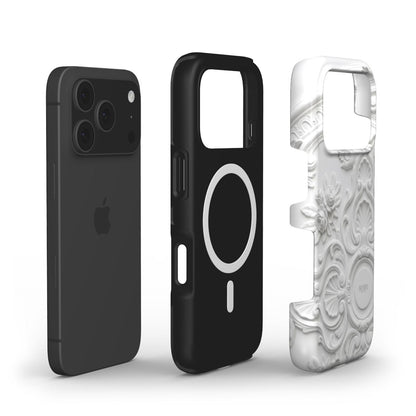 Two phone cases displayed with one featuring a sleek black design and the other a flerfarvet white and beige embossed pattern inspired by Ivory Stucco style