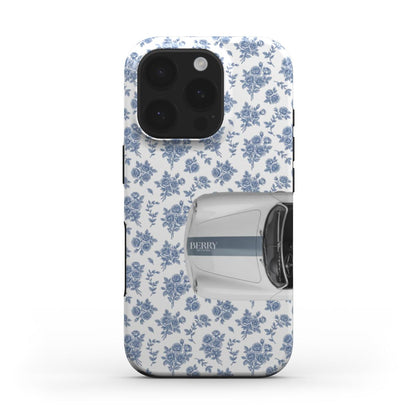 Trendy feminine phone case with blue floral pattern and stylish white vintage car design, blending girly charm with a beautiful aesthetic look.