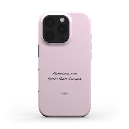 Trendy pink phone case with elegant script reading "Memories are better than dreams," featuring a girly and feminine aesthetic for a popular look.