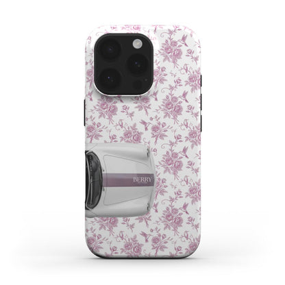 Trendy feminine phone case with multicolored pink and white floral pattern featuring a stylish vintage car design, perfect for that girly aesthetic.