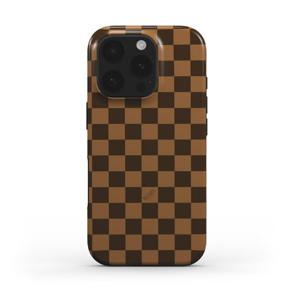 Trendy phone case with a bronze and beige checkered pattern, featuring a stylish and feminine aesthetic perfect for a popular girly look.