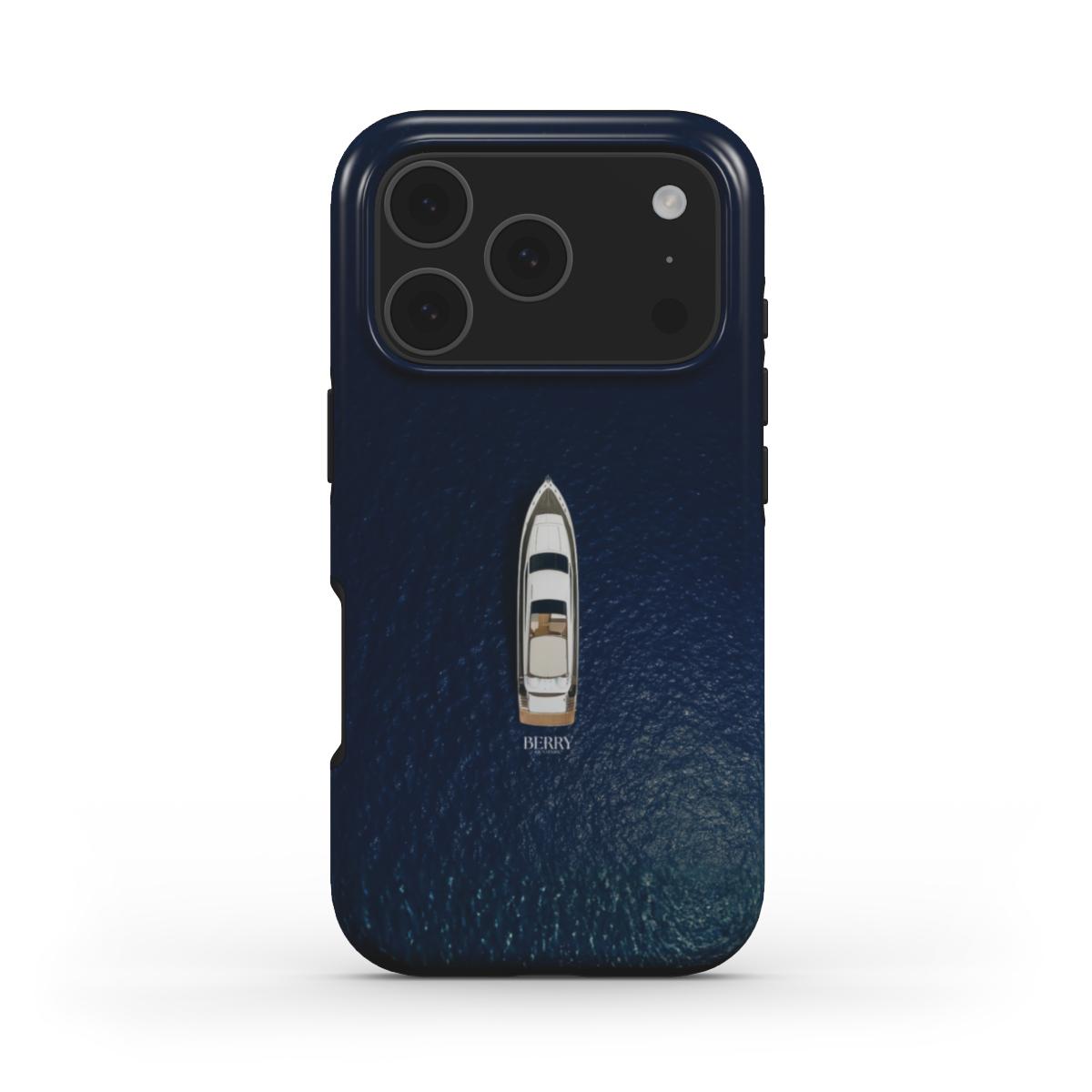 Trendy phone case with a blue multicolored water design featuring a sleek boat, perfect for a feminine and stylish look.
