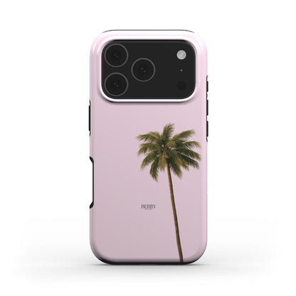 Trendy pink phone case with a minimalist palm tree design, featuring a feminine and popular look in green, beige, and multicolor tones.