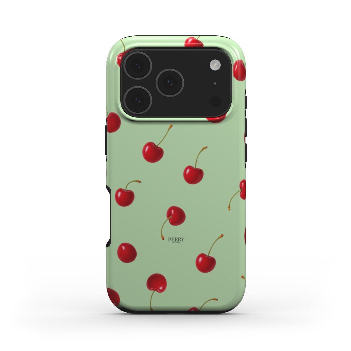 Trendy feminine phone case in green with a stylish red cherry pattern, perfect for a beautiful and girly aesthetic that is popular and playful.