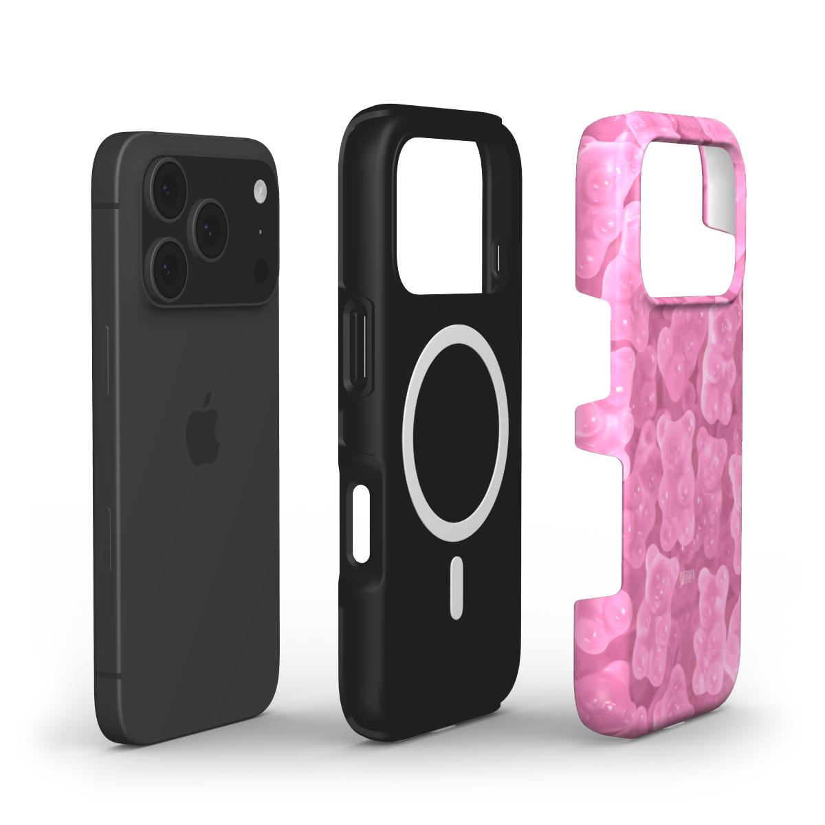 Three-part phone case including a pink, flerfarvet patterned outer shell with a trendy feminine gummy bear design and a black protective inner layer.