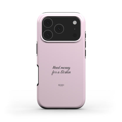 Trendy feminine pink phone case with elegant script reading "Need money for a Birkin," combining a girly aesthetic with a popular stylish design.