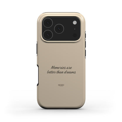 Beige trendy phone case with elegant cursive text "Memories are better than dreams," offering a feminine and popular aesthetic for stylish phone protection.