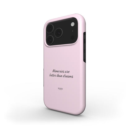 Trendy pink phone case featuring elegant script saying "Memories are better than dreams," combining feminine style with a popular aesthetic for that girl vibe.