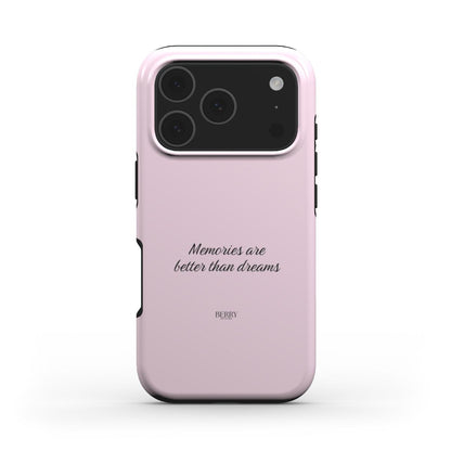 Trendy pink phone case with elegant script reading "Memories are better than dreams," showcasing a feminine and stylish aesthetic.