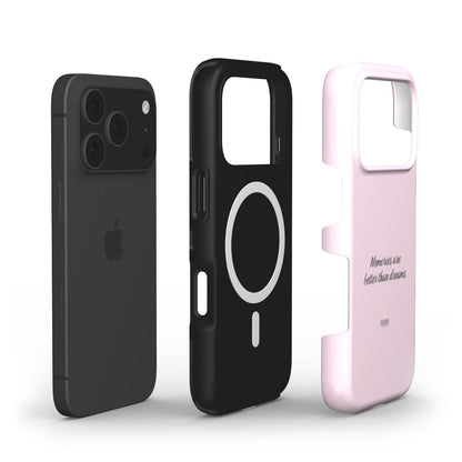 Trendy pink phone case with a feminine design and inspiring "Memories are better than dreams" text, paired with a sleek black wireless charging compatible case.