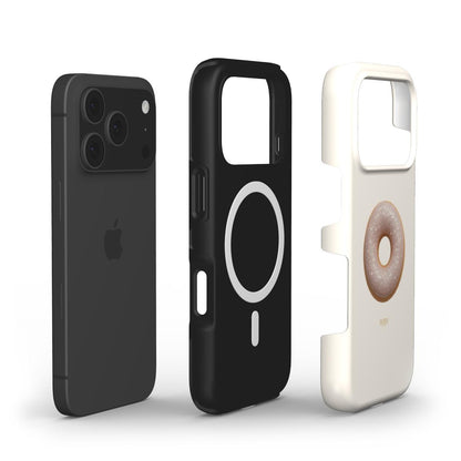 Black and beige phone cases with minimalist designs, featuring a modern MagSafe ring and a soft donut illustration in beige, gold, multicolor, and brown tones.