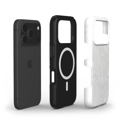 Sleek black phone alongside trendy clear quartz patterned case and solid black protective cover with magnetic ring, all showcasing a modern, feminine style.