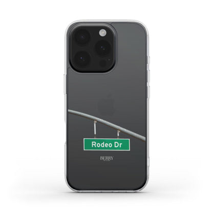 Clear trendy phone case with a green Rodeo Drive street sign design, featuring a girly and feminine aesthetic in a transparent style.