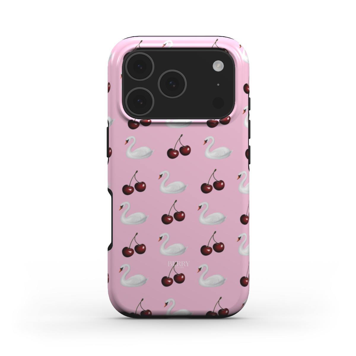 Trendy pink phone case with a girly pattern of white swans and cherries, combining a feminine and aesthetic look for that popular stylish vibe.