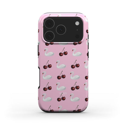 Trendy pink phone case with a girly pattern of white swans and cherries, combining a feminine and aesthetic look for that popular stylish vibe.