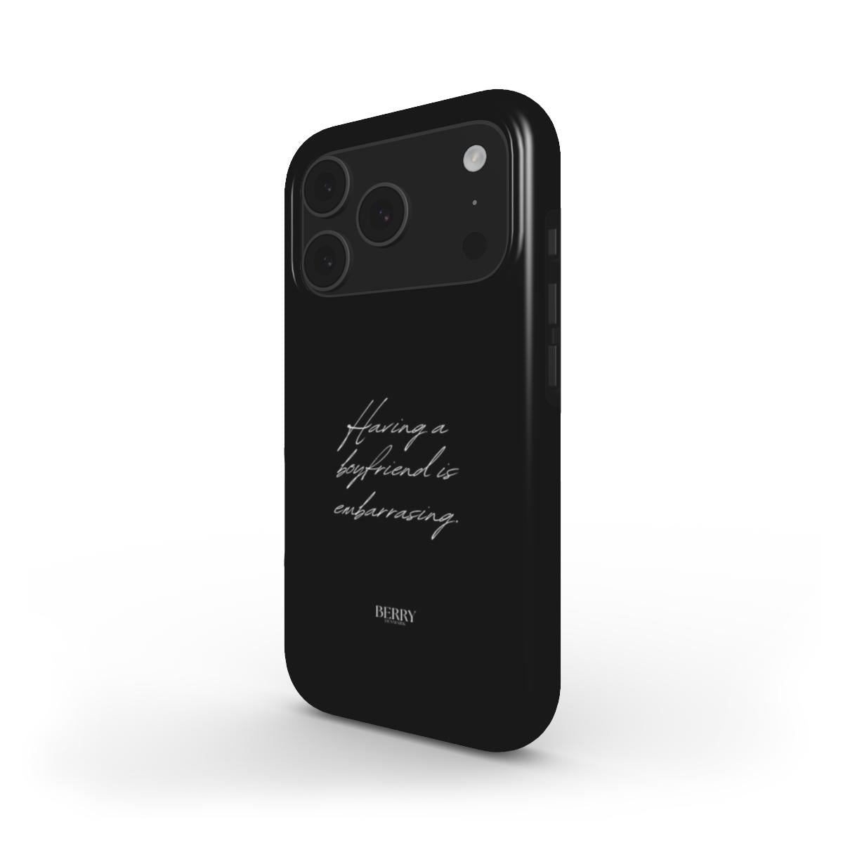 Black trendy phone case with elegant white cursive text saying having a boyfriend is embarrassing, featuring a sleek and feminine aesthetic design.