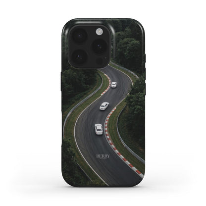 Trendy phone case in green and black featuring a winding road with white cars, combining stylish feminine charm with a sleek, popular design.