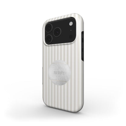 Trendy phone case with vertical beige and white stripes featuring a textured tennis ball design, perfect for a stylish and feminine look.