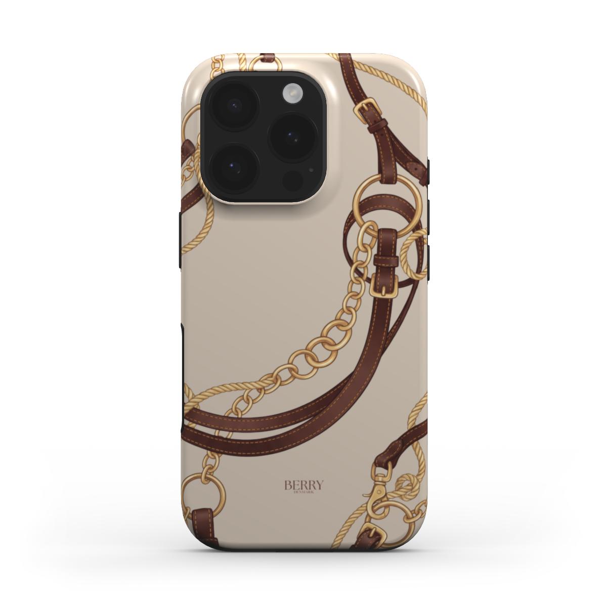 Trendy phone case with a feminine equestrian design featuring multicolored gold, brown, and beige chains and leather straps on a chic background.
