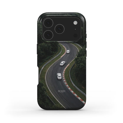 Trendy phone case with a green and black winding road design featuring white cars, blending feminine style with a sleek, popular aesthetic.
