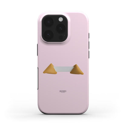 Trendy feminine phone case in soft pink featuring a unique fortune cookie design with gold, beige, and brown accents for a stylish, girly look.